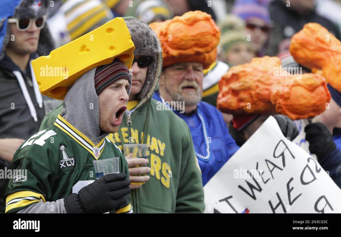 Green Bay Packers fans wear cheese hats while Buffalo Bills fans wear chicken  wing hats during the first half of an NFL football game against the Buffalo  Bills Sunday, Dec. 14, 2014,