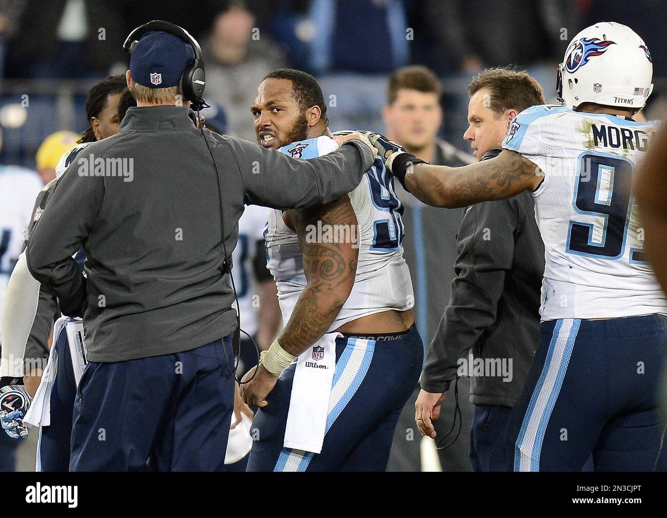 Tennessee Titans defensive end Jurrell Casey (99) looks back toward the  field as he is led to the sideline following a fight with New York Jets  players in the second half of