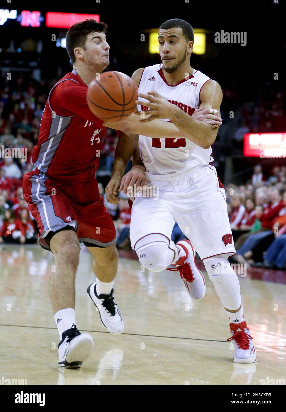 Wisconsin guard Traevon Jackson, right, is fouled by Nicholls State