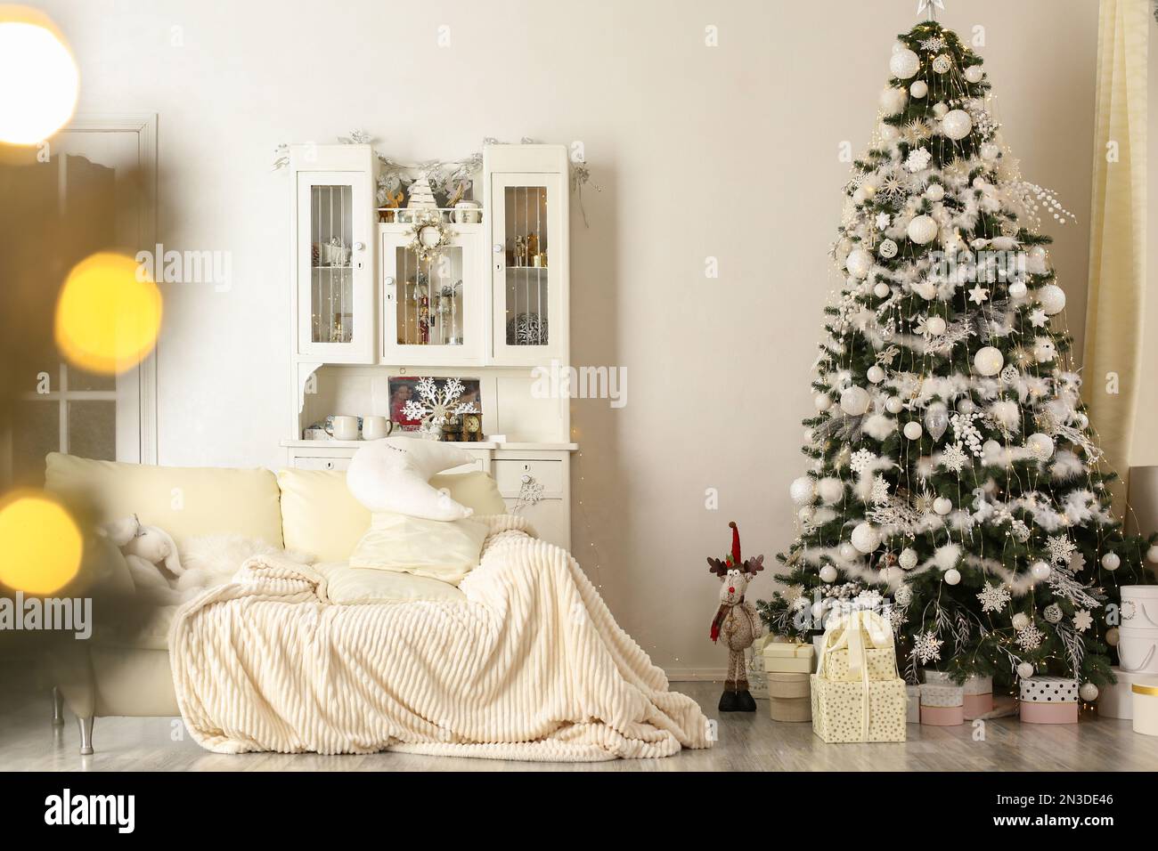Stylish living room interior with decorated Christmas tree Stock Photo ...