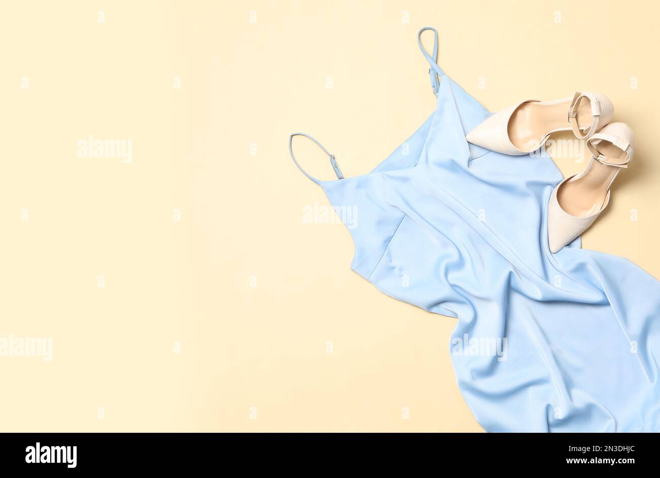Stylish light blue dress and shoes on beige background Stock Photo - Alamy