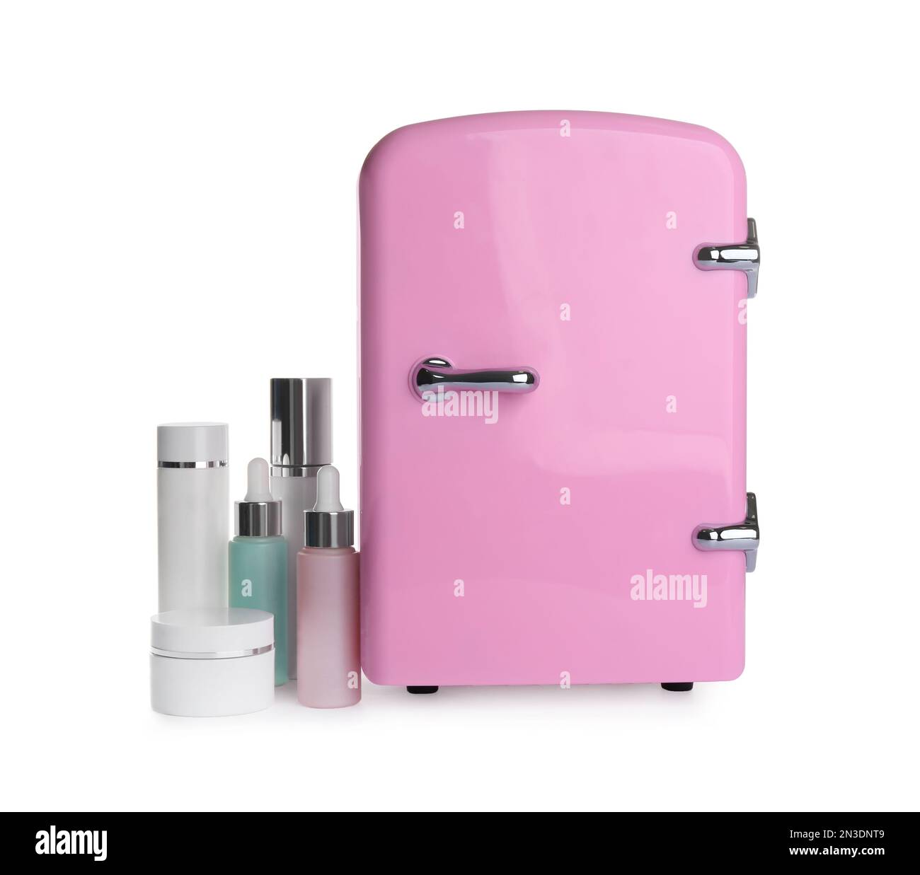 Pink cosmetics refrigerator and skin care products on white background