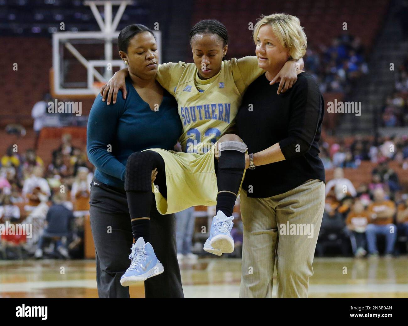 Southern’s Kendra Coleman (23) is carries off the court after she