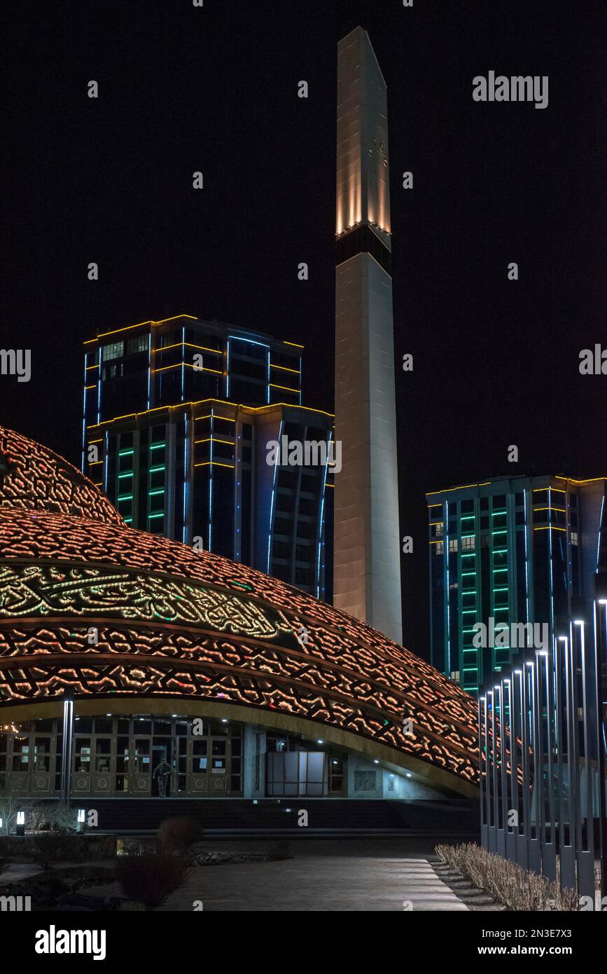 Close-up of the Aimani Kadyrova Mosque illuminated at night; Argun, Chechen Republic, Russia Stock Photo