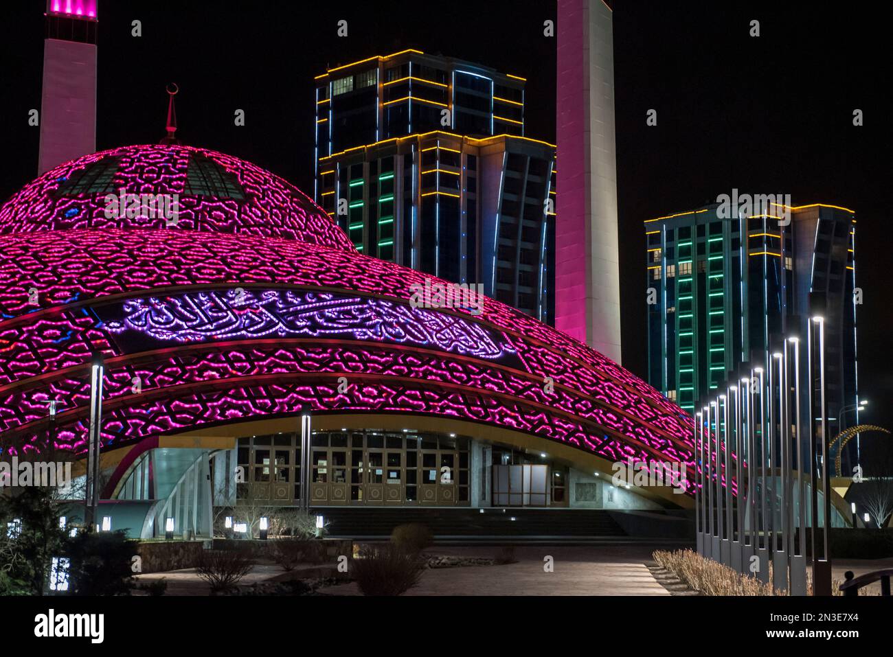 Close-up of the Aimani Kadyrova Mosque illuminated at night; Argun, Chechen Republic, Russia Stock Photo