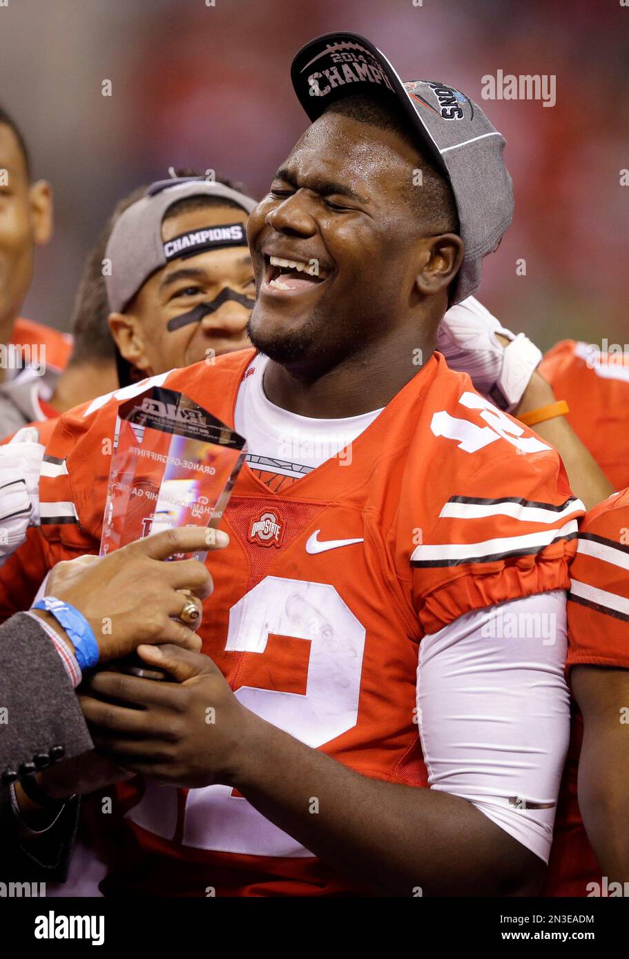 Ohio State quarterback Cardale Jones celebrates following the Big Ten Conference championship NCAA college football game after midnight Sunday, Dec. 7, 2014, in Indianapolis. Ohio State defeated Wisconsin 59-0. (AP Photo/Michael Conroy) Stock Photo