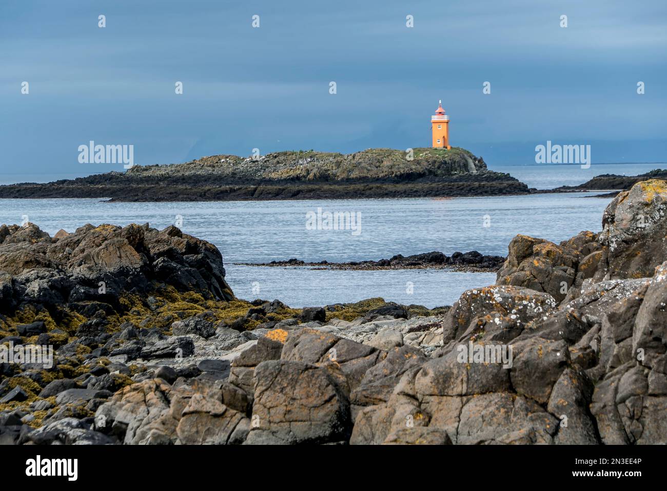 Lighthouse on the town of Flatey, Iceland, a former fishing village that is now a tourist destination; Flatey, Iceland Stock Photo