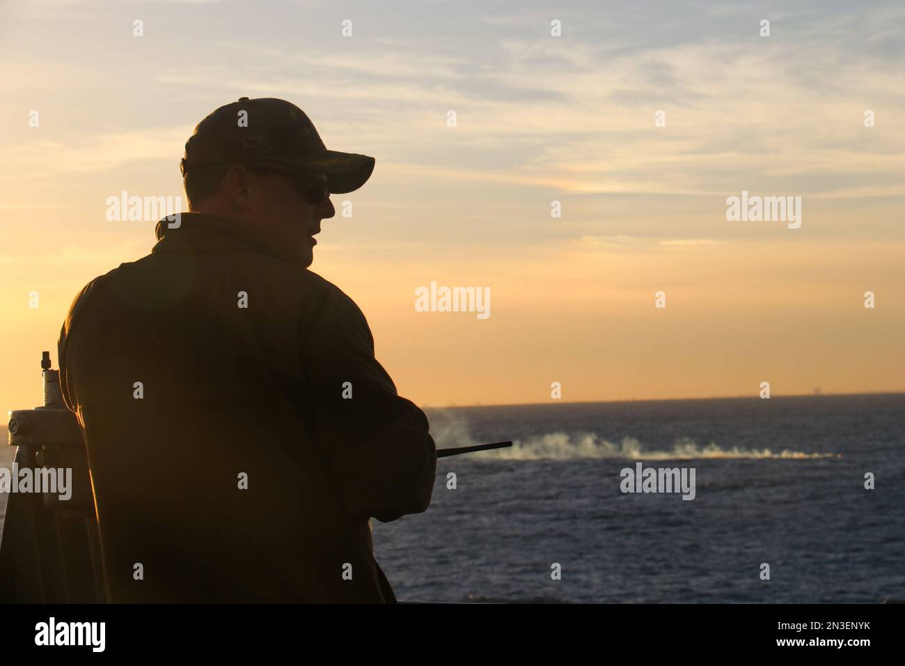 Myrtle Beach, United States of America. 04 February, 2023. U.S Navy Cmdr. Brad A. Fancher, commanding officer of the dock landing ship USS Carter Hall, looks out over the debris field of the Chinese high-altitude surveillance balloon as recovery operations begin on the Atlantic Ocean, February 4, 2023 off the coast of Myrtle Beach, South Carolina. The suspected spy balloon was shot down by American fighter aircraft on February 4th after traveling across the continental United States. Credit: Lt. Jerry Ireland/US Navy Photo/Alamy Live News Stock Photo