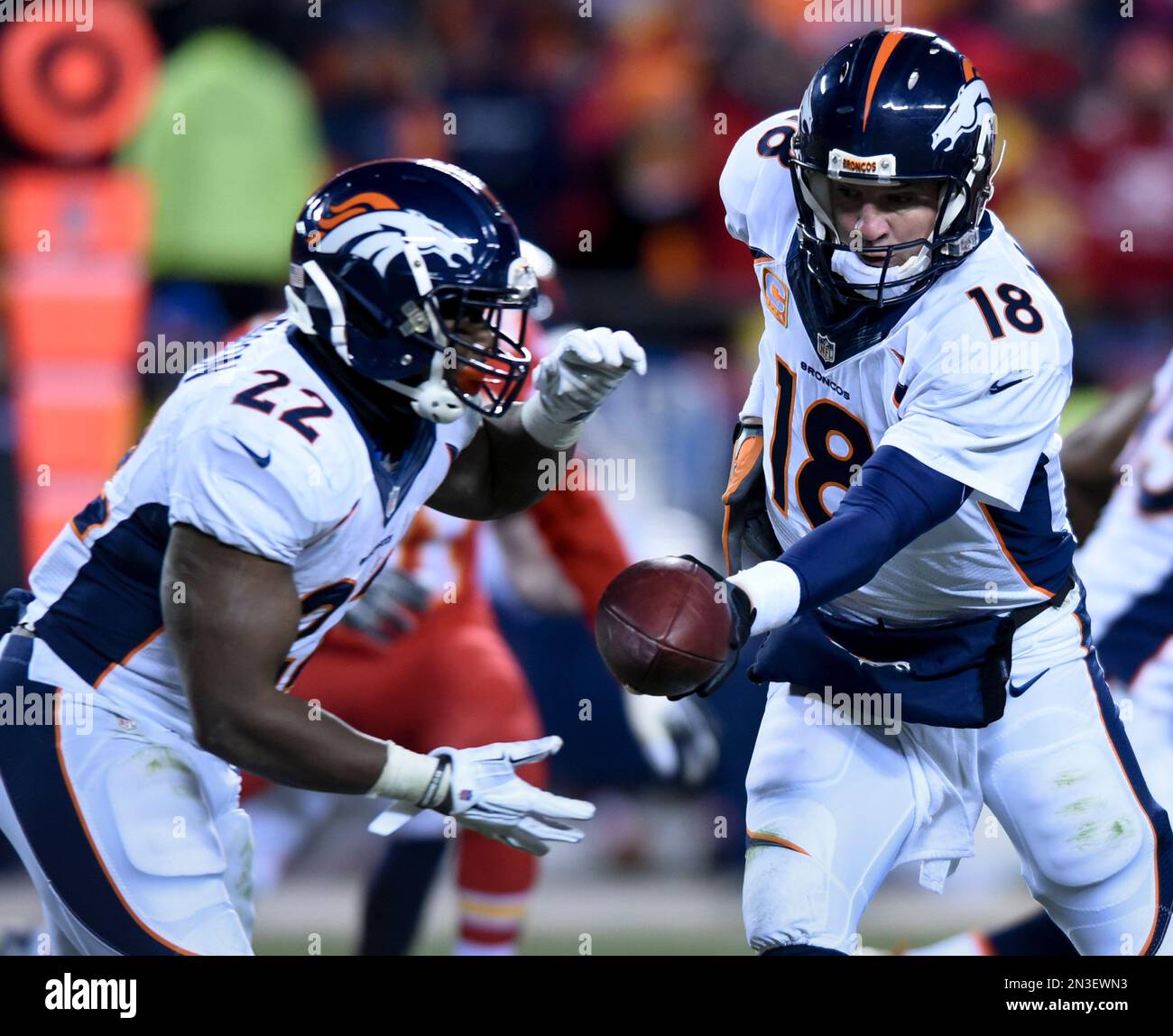 Denver Broncos quarterback Peyton Manning (18) hands off to Denver ...