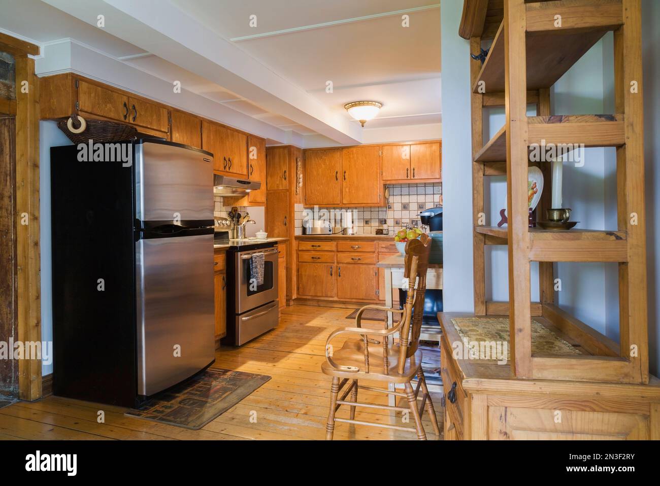 Kitchen with cherry wood wooden buffet and pine wood