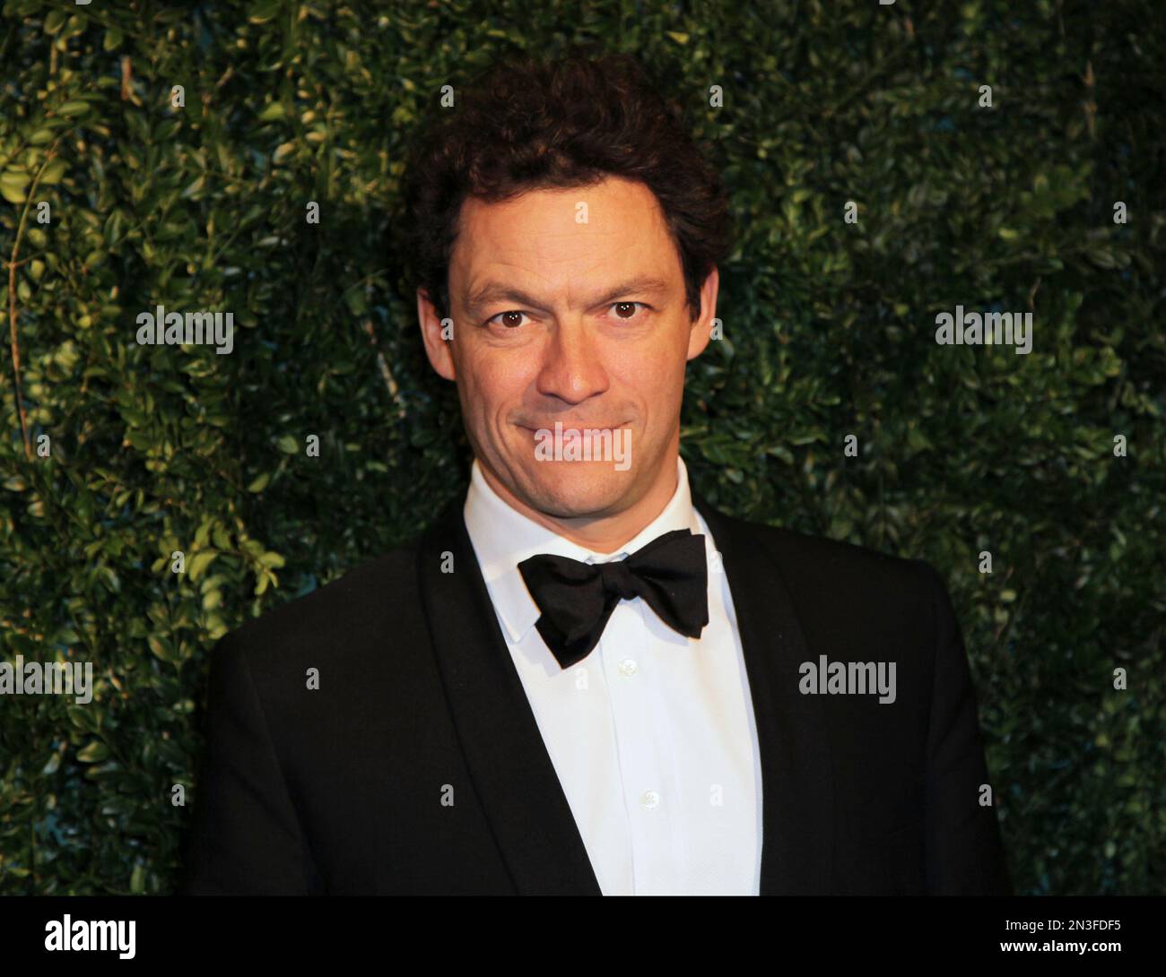 Actor Dominic West poses for photographers on arrival at the Evening