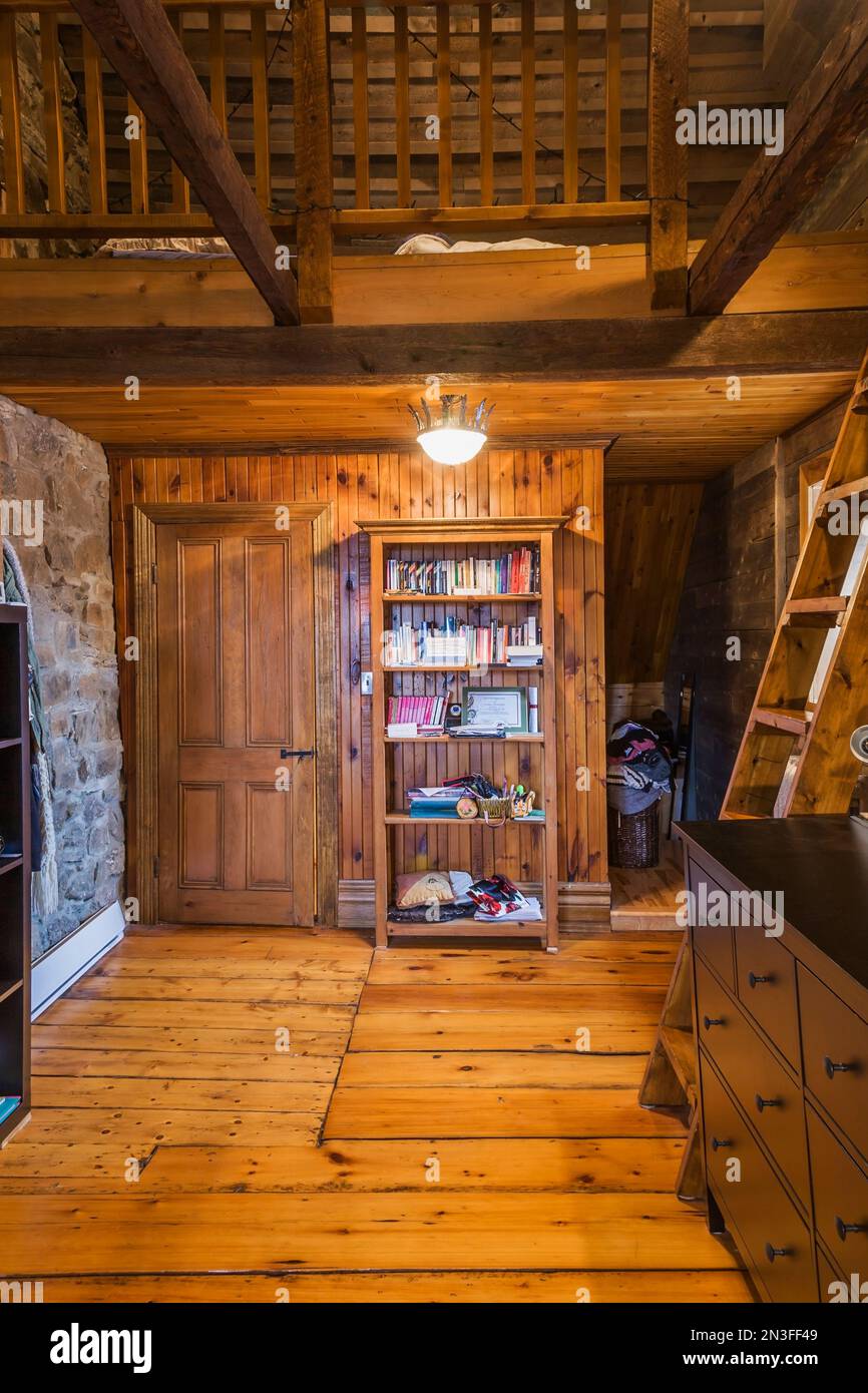 Attic bedroom with large pinewood floorboards, Miller's stairs and bed