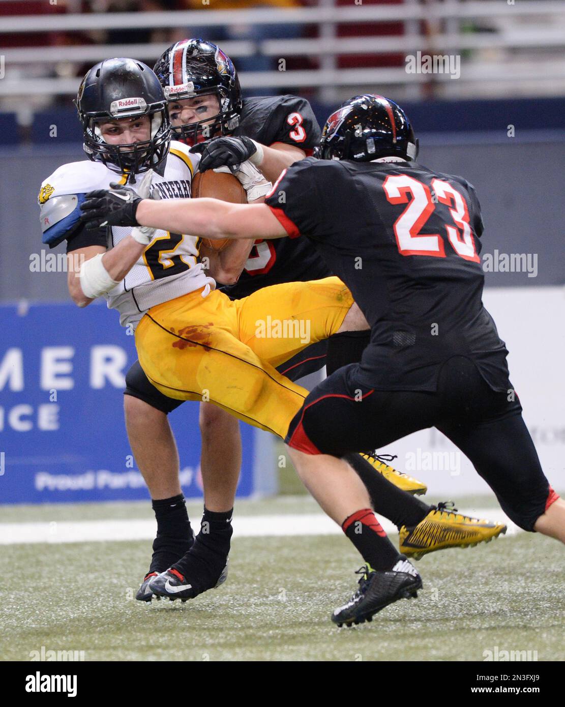 Stanberry's Michael Shanks (27) is tackled by North Andrew's Derek
