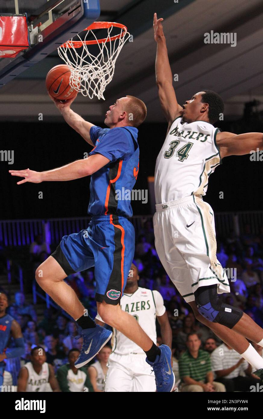 Florida's Jacob Kurtz (30) goes in for a lay up in front of UAB's