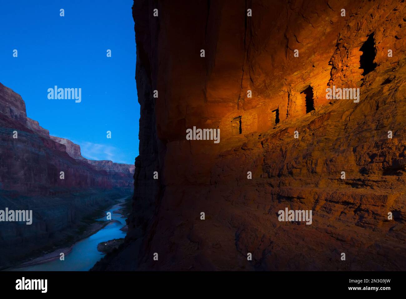 Ancestral Pueblo Indian graneries carved into canyon walls. Stock Photo