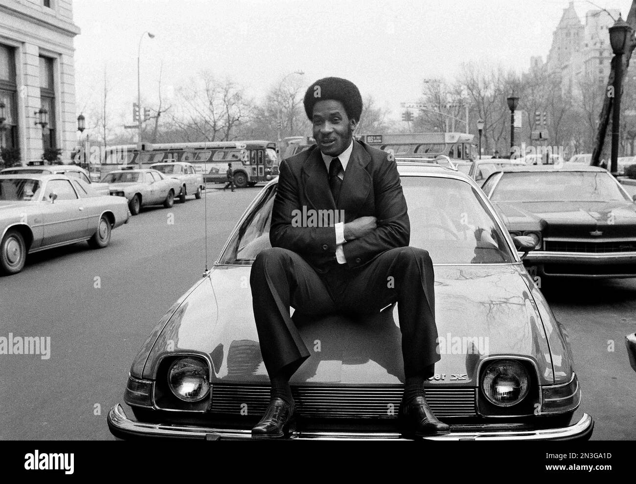 Wide receiver Lynn Swann (88) of the Pittsburgh Steelers and Super Bowl X's MVP, is shown in New York, Jan. 29, 1976. Swann sits on the hood of his latest prize, a 1976 GMC Pacer awarded to him by Sport Magazine. (AP Photo/Harry Harris) Stock Photo