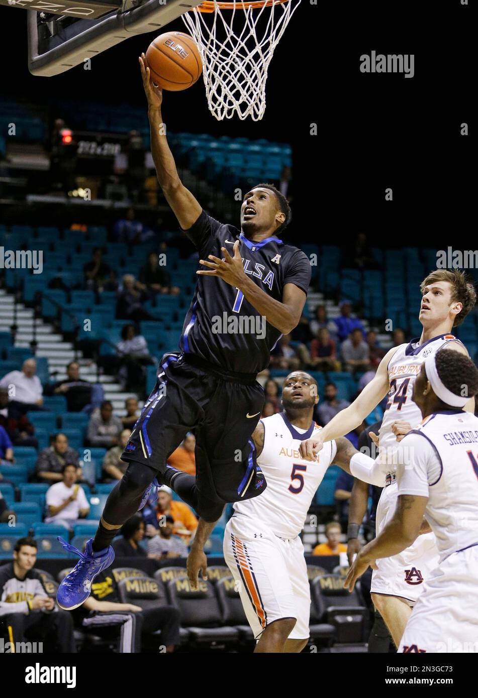 Tulsa guard Rashad Smith (1) goes up for a shot against Auburn during ...