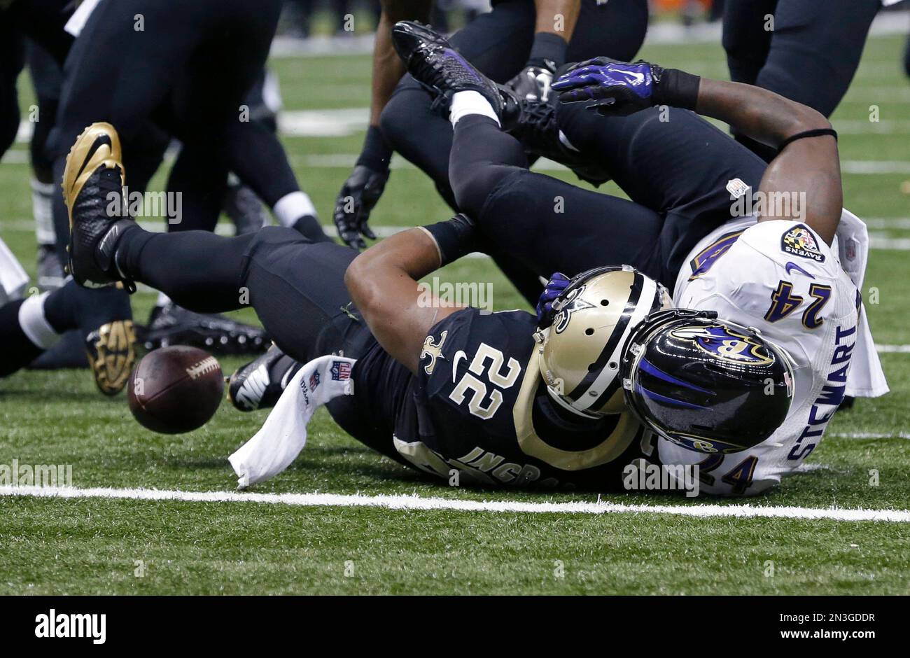 Baltimore Ravens cornerback Jimmy Smith (22) loses the football near