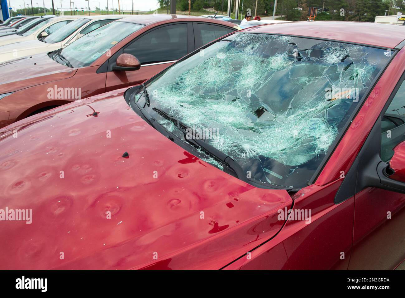 Parked car with severe hail damage; Blair, Nebraska, United States of America Stock Photo