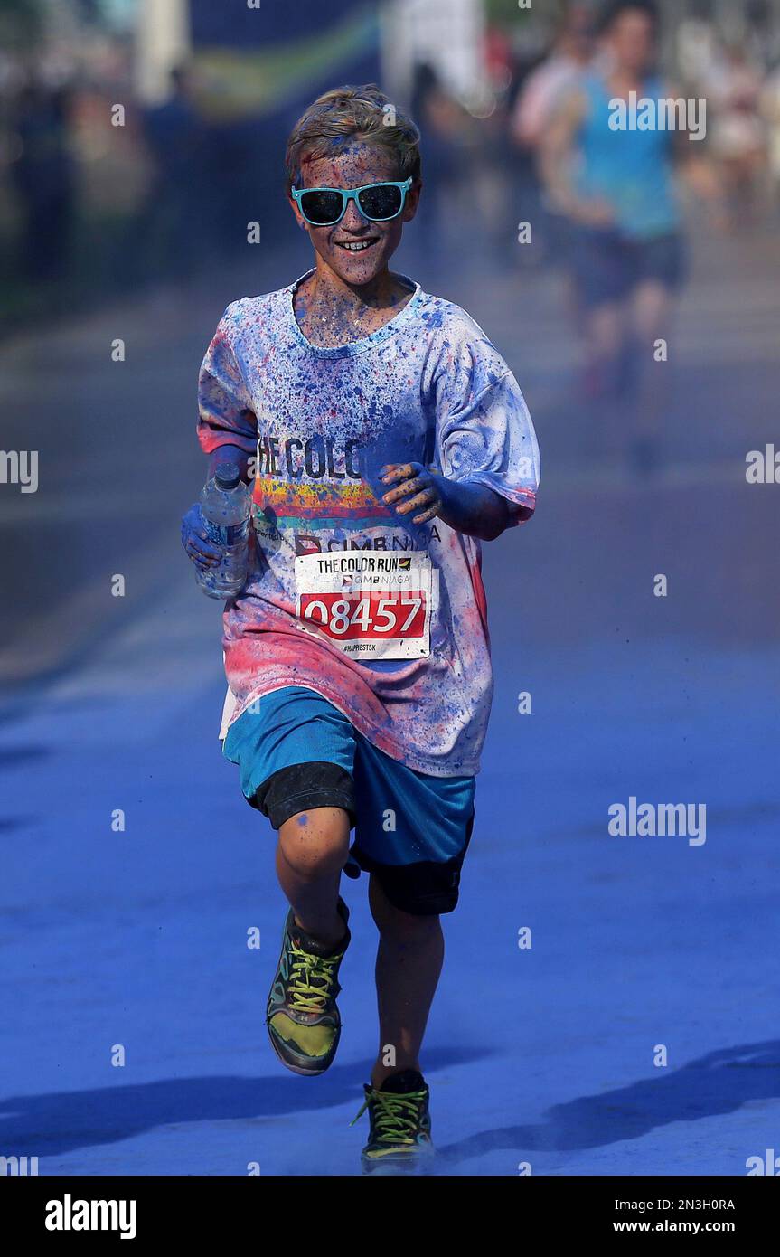 https://c8.alamy.com/comp/2N3H0RA/a-participant-runs-during-the-color-run-in-jakarta-indonesia-sunday-nov-23-2014-dubbed-the-happiest-5k-on-the-planet-the-color-run-is-a-5-kilometer-fun-run-event-that-sees-participants-go-through-a-few-color-stations-where-they-are-doused-with-colored-powder-ap-phototatan-syuflana-2N3H0RA.jpg