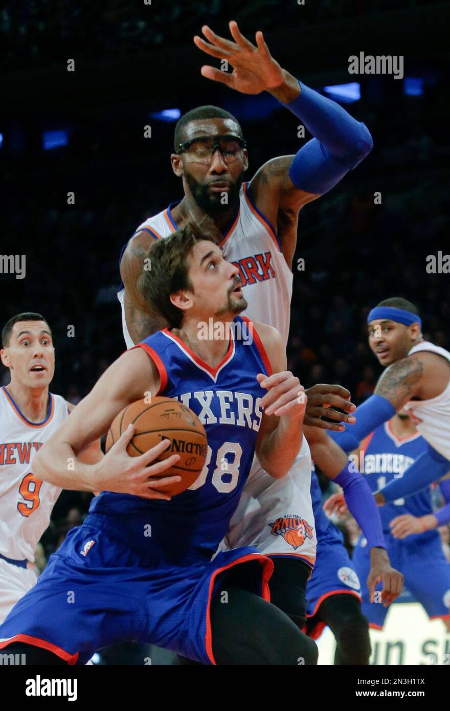 Philadelphia 76ers' Alexey Shved (88), of Russia, drives past New York ...
