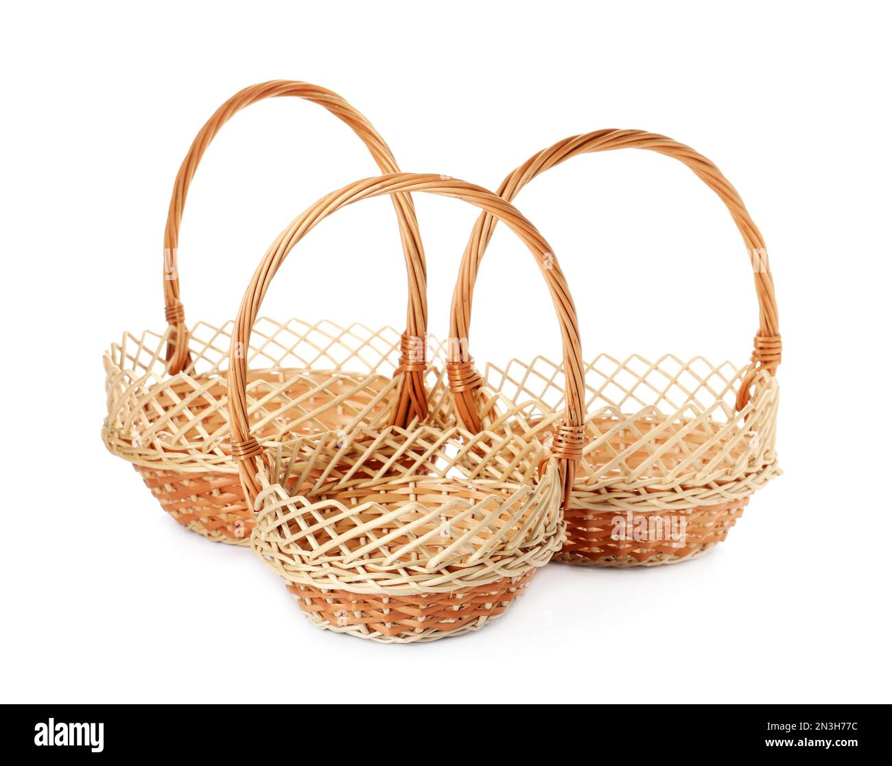 Three decorative wicker baskets on white background Stock Photo Alamy