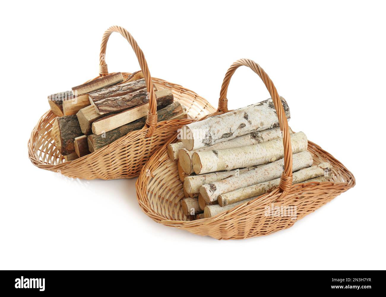 Wicker baskets with firewood on white background Stock Photo Alamy