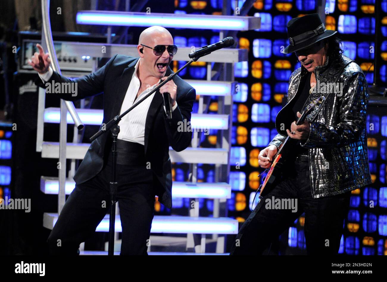 pitbull-left-and-carlos-santana-perform-at-the-15th-annual-latin