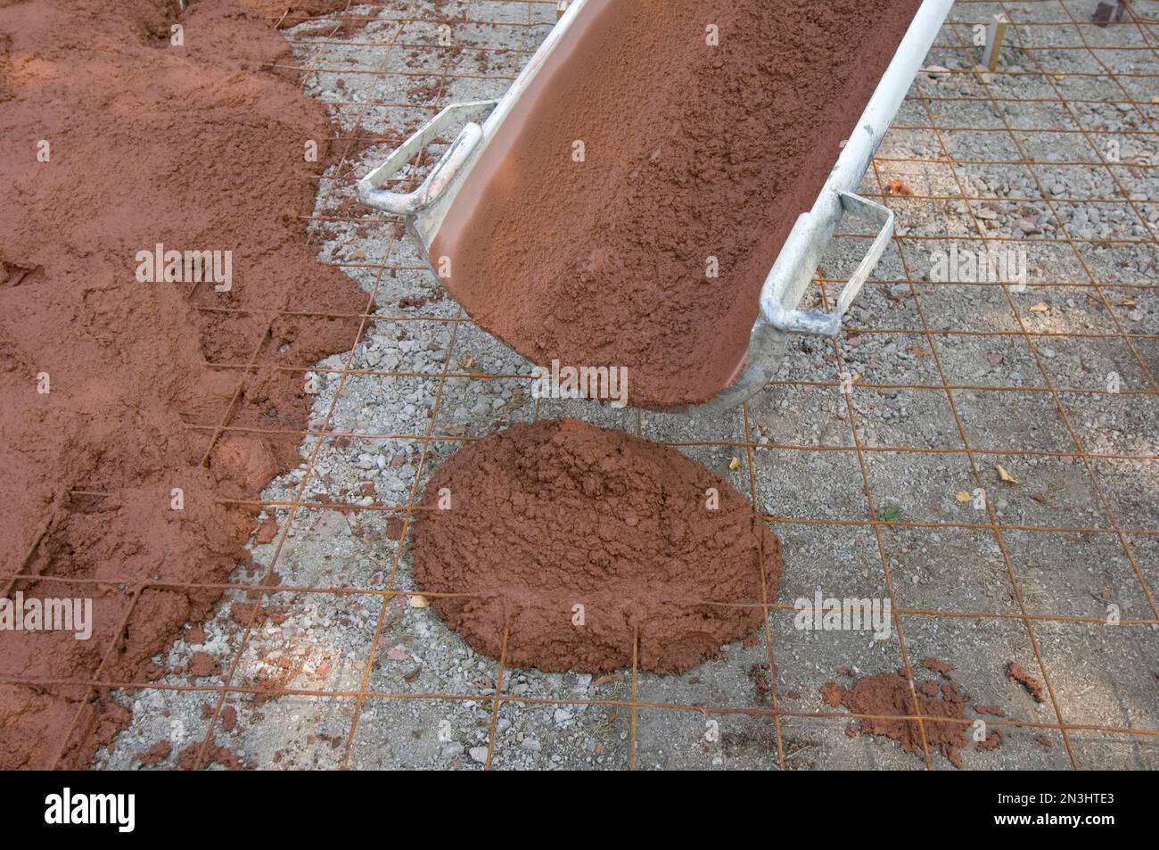 Redtinted concrete is poured as a new driveway; Lincoln, Nebraska