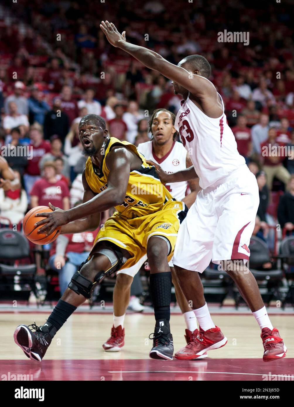 Alabama State's Robert Ojeah (45) drives the ball as Arkansas' Michael