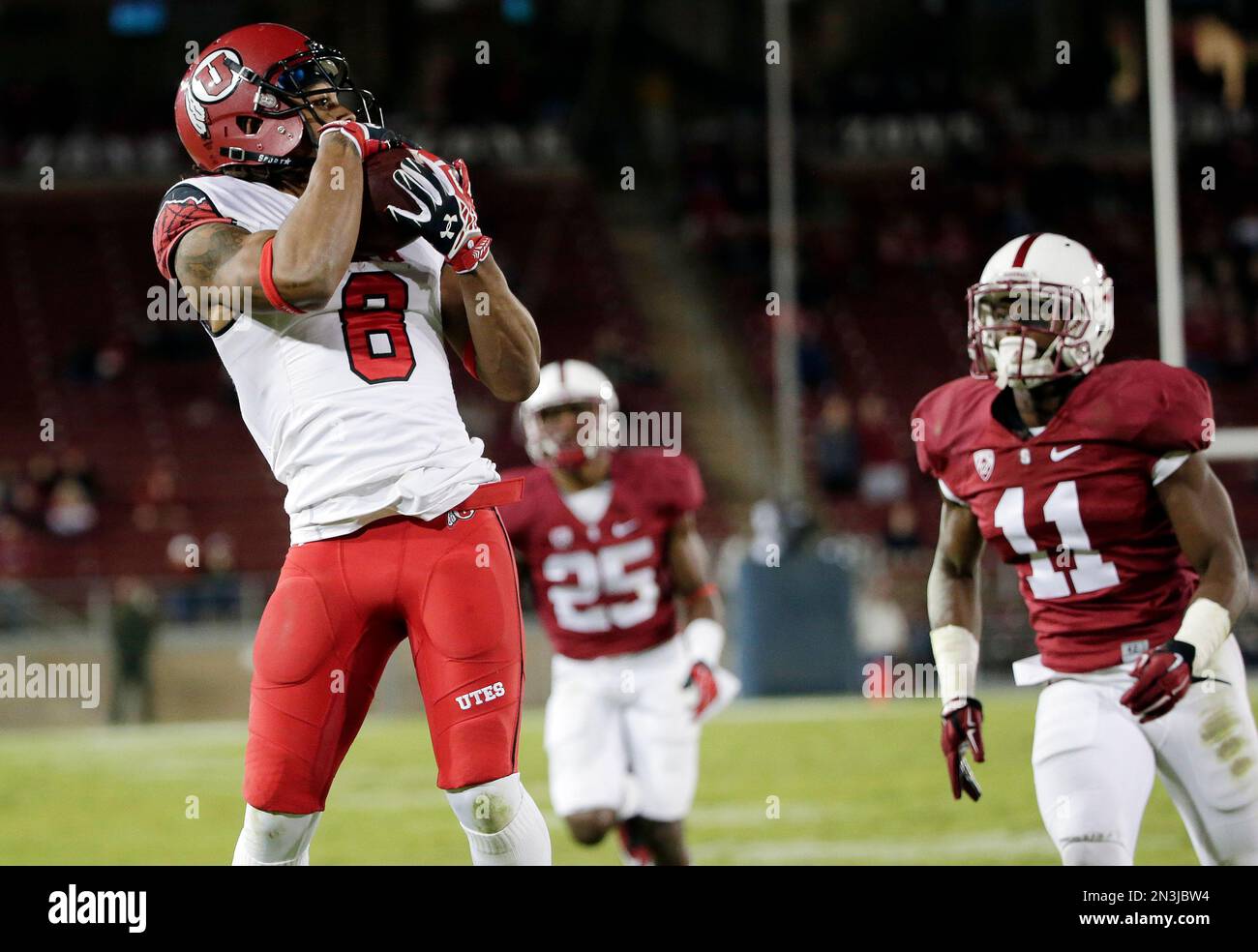 Utah wide receiver Kaelin Clay, left, makes a touchdown catch next to ...