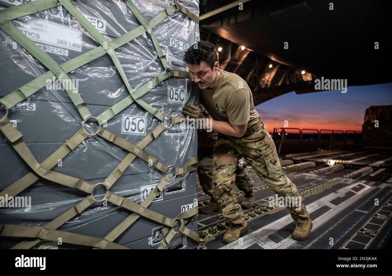 Dover, United States. 07th Feb, 2023. U.S Air Force Senior Airman Garrett LaMarche, 6th Airlift Squadron loadmaster, pushes a cargo pallet of emergency supplies into a C-17 Globemaster III cargo aircraft at Dover Air Force Base, February 7, 2023 in Dover, Delaware. The U.S. Agency for International Development is mobilizing emergency humanitarian assistance to respond to the massive destruction following a 7.8 earthquake in Turkey. Credit: SSgt. Marco Gomez/US Air Force Photo/Alamy Live News Stock Photo