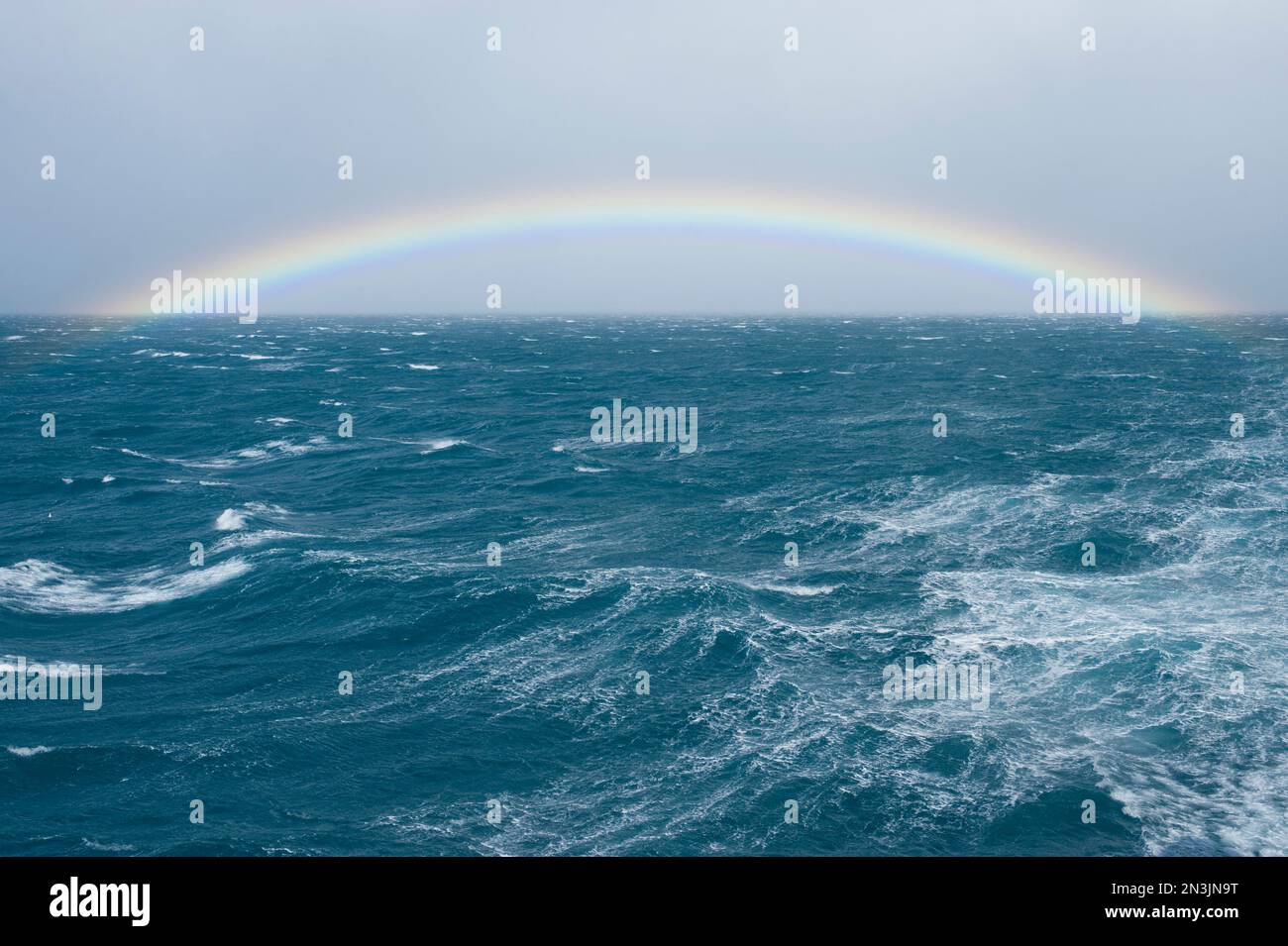 Rainbow at sea off the coast of South Island; South