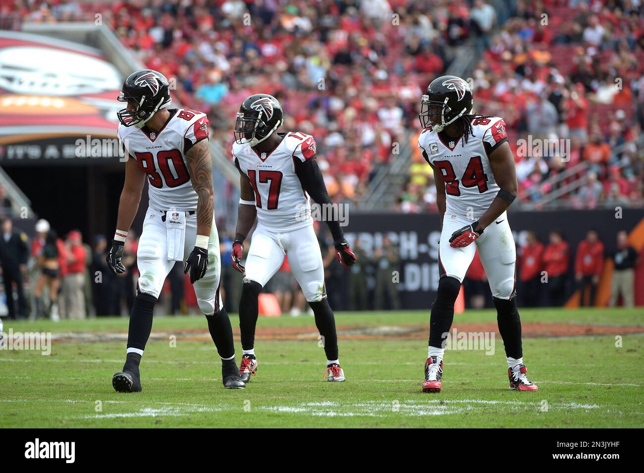 Atlanta Falcons' Devin Hester, Roddy White and Harry Douglas, from left,  jump before the first half of an NFL preseason football game against the  Miami Dolphins, Friday, Aug. 8, 2014, in Atlanta. (