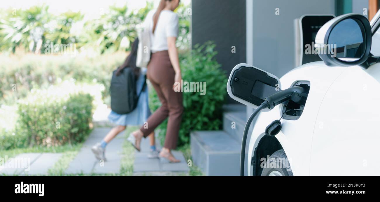 Focus electric vehicle recharging at home charging station plugged in
