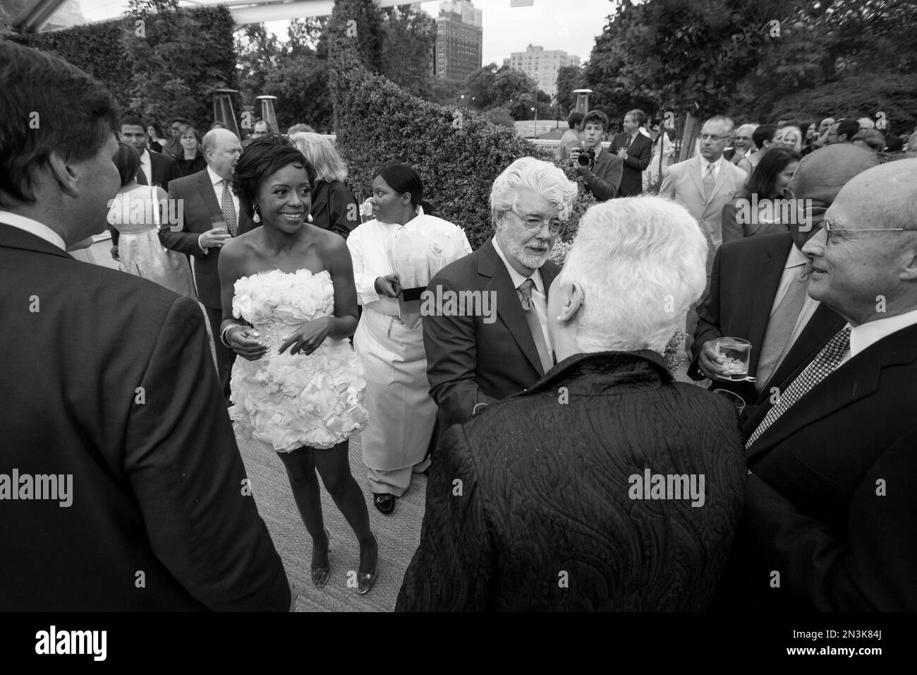 Mellody Hobson and Lucas, center, greet their guests during(02)