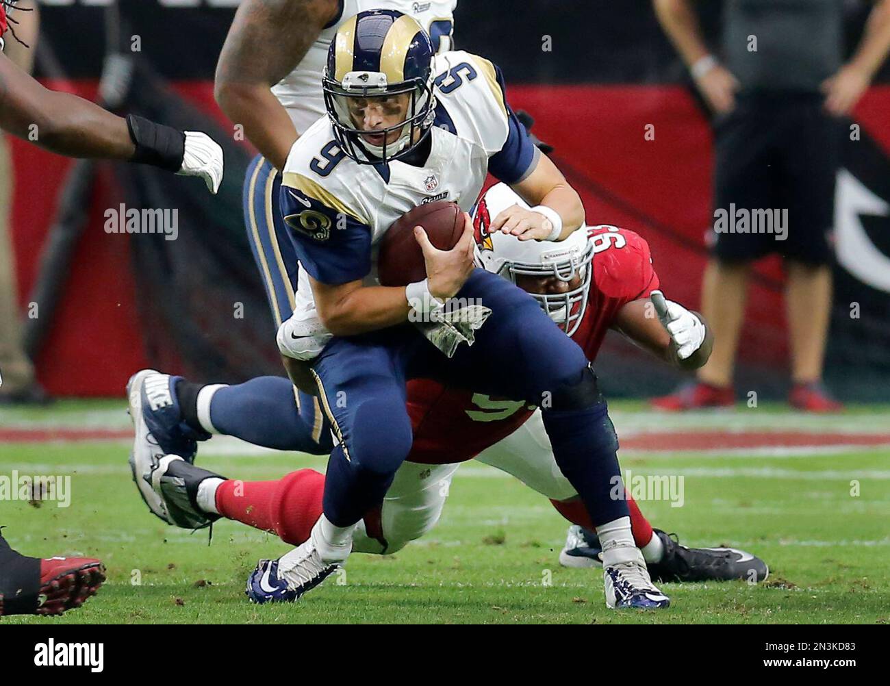 St. Louis Rams quarterback Austin Davis (9) is sacked by Arizona ...