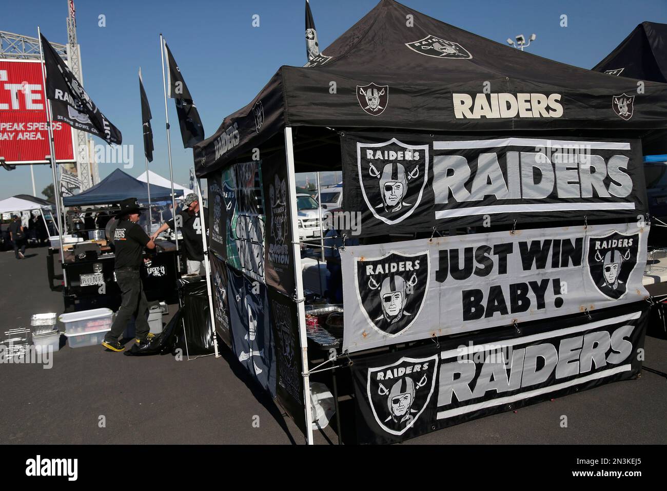 Oakland Raiders fans tailgate in the O.co Coliseum parking lot before