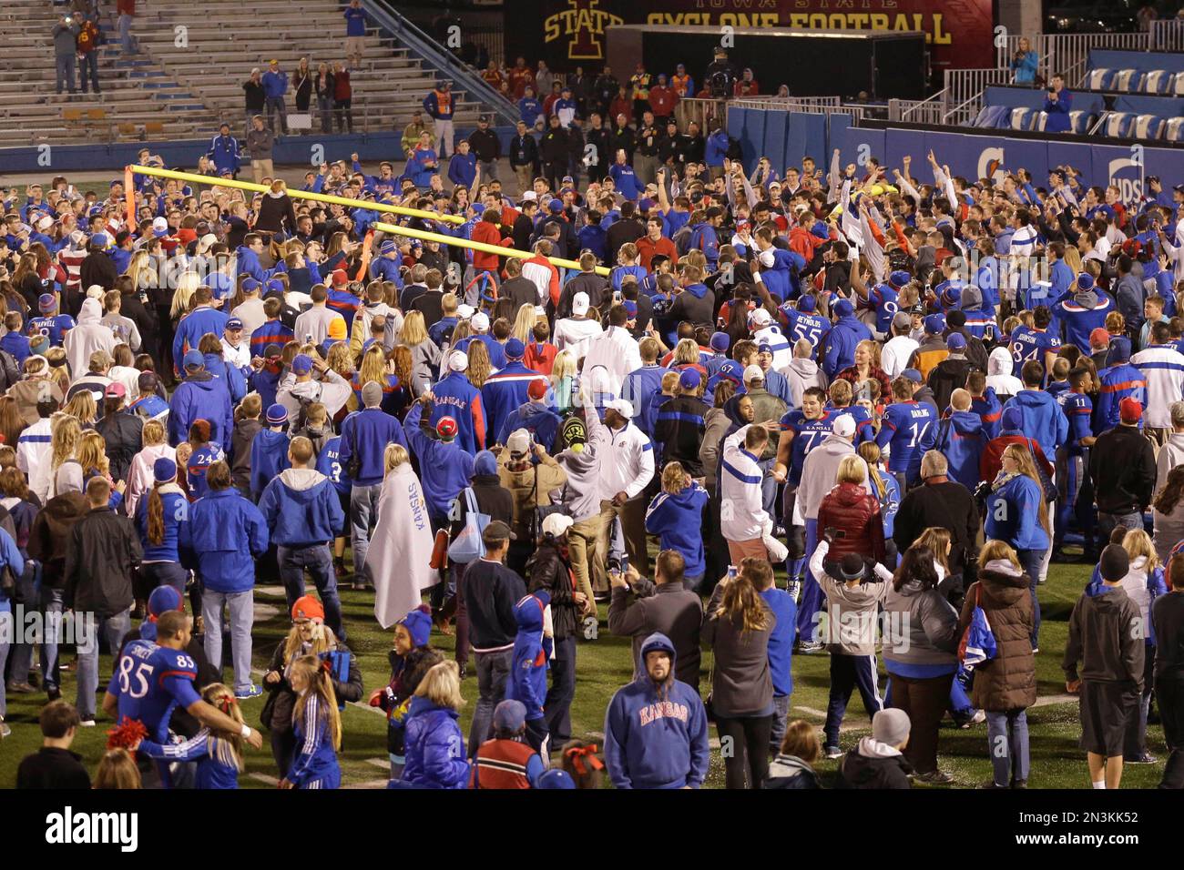 Kansas students and fans tear down the goalposts following an NCAA