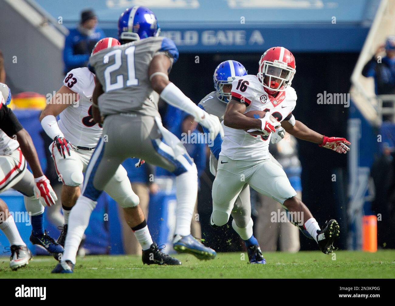 Georgia wide receiver Isaiah McKenzie, right, returns a kickoff for a ...