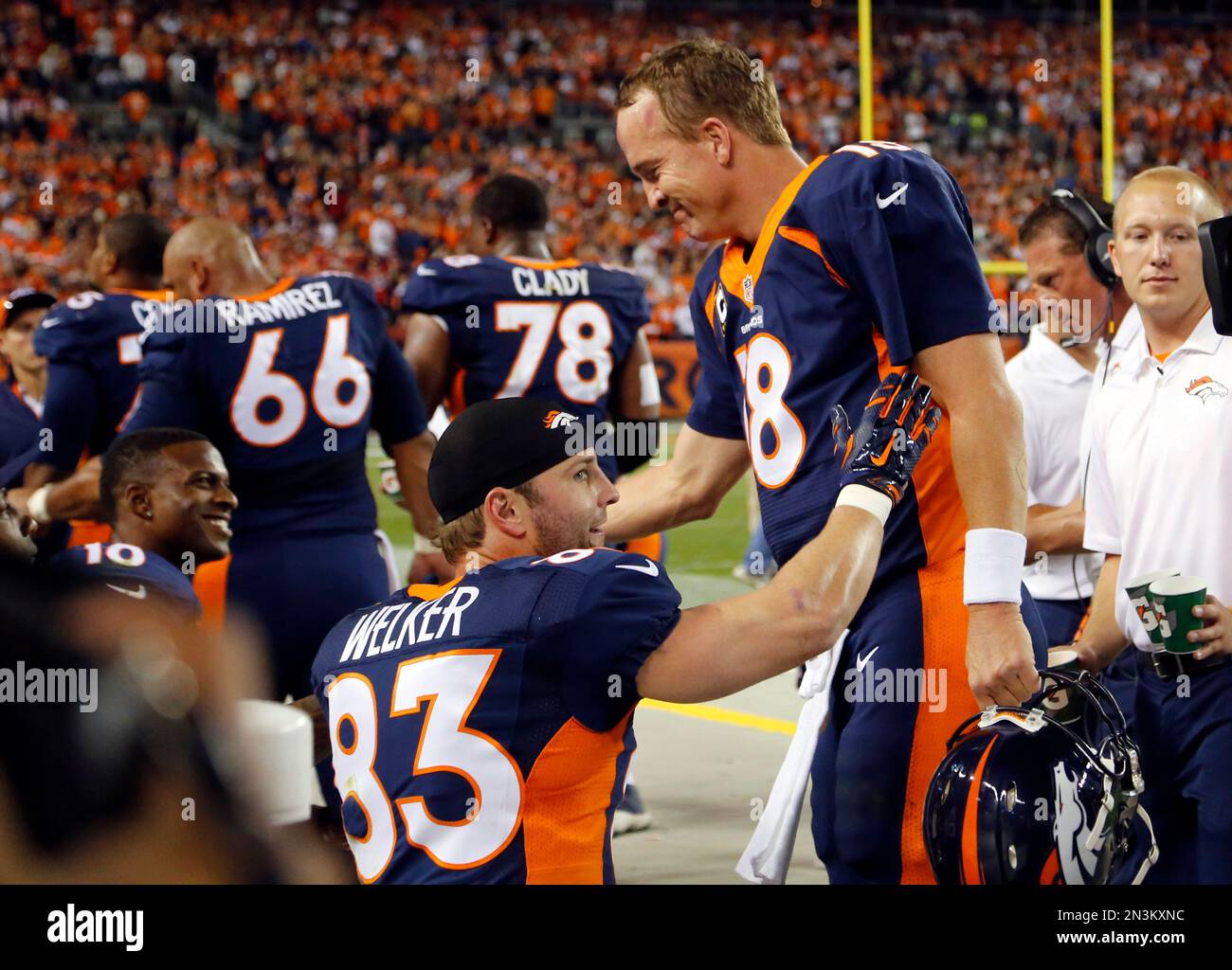 Denver Broncos quarterback Peyton Manning is congratulated by teammates ...