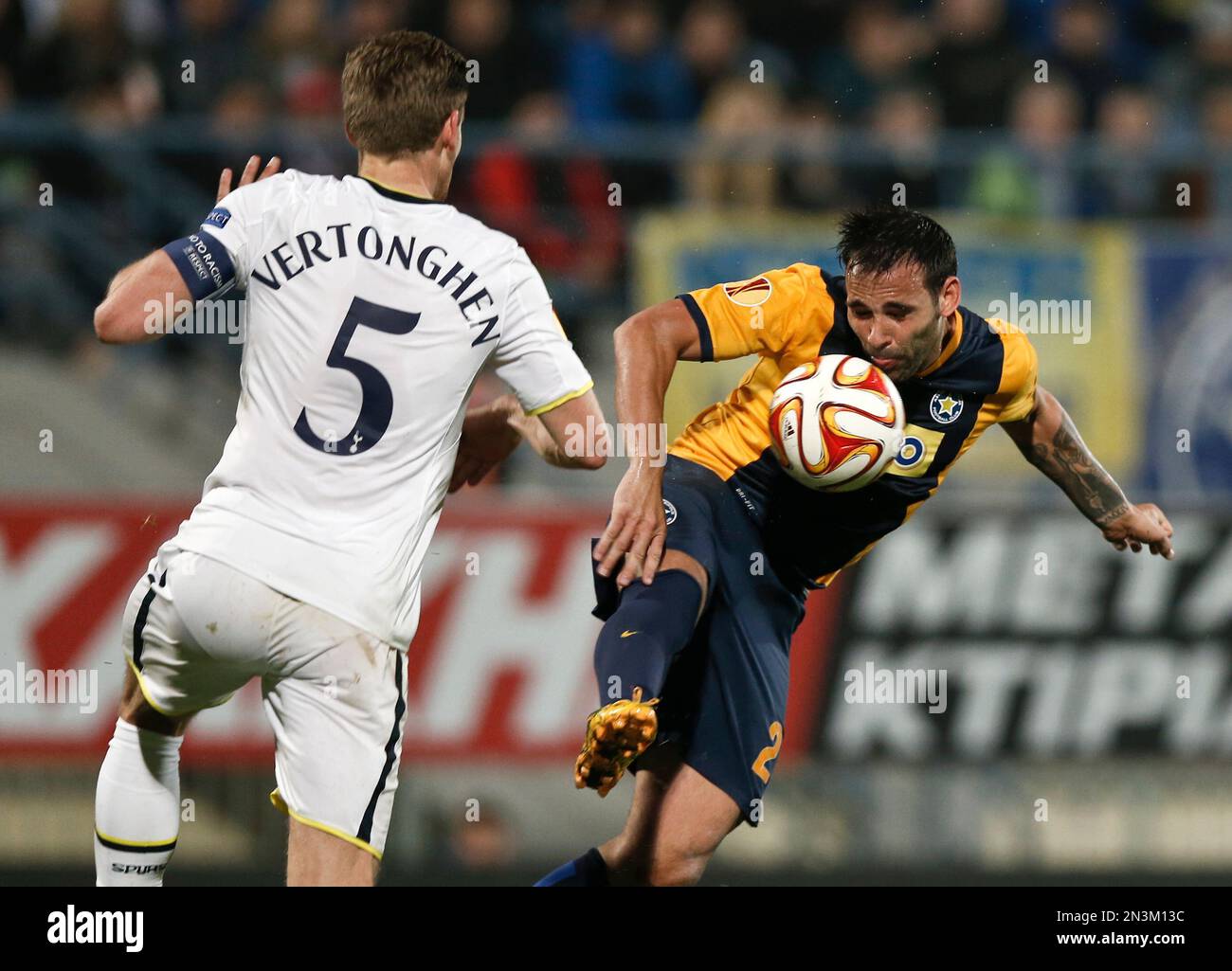 Asterass Facundo Parra, right, challenges in the air with Tottenham  Hotspurs Jan Vertonghen during the Europa League group C soccer match  between Asteras Tripolis and Tottenham at the Theodoros Kolokotronis  stadium stadium