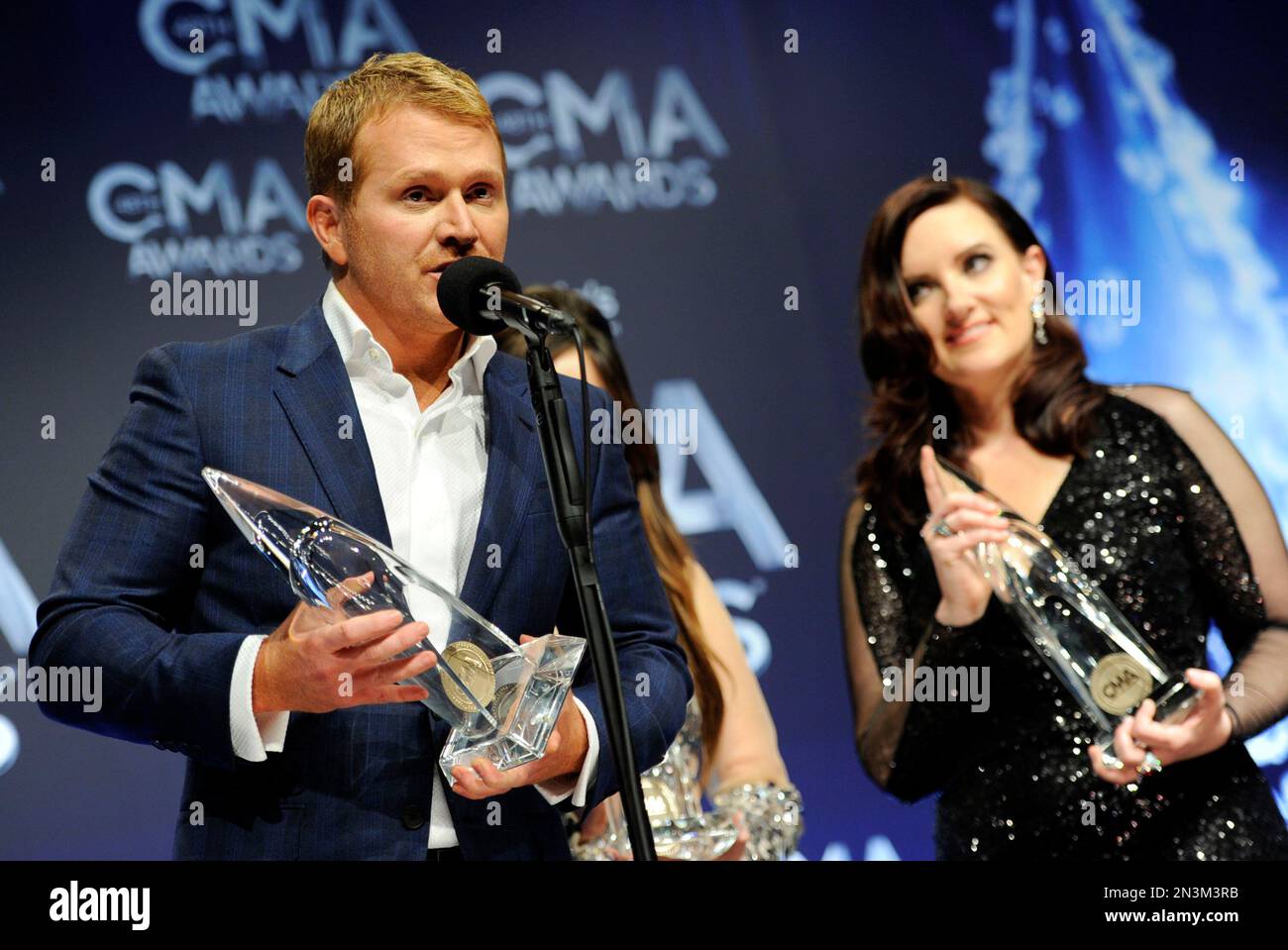 Shane McAnally, left, and Brandy Clark pose in the press room with the