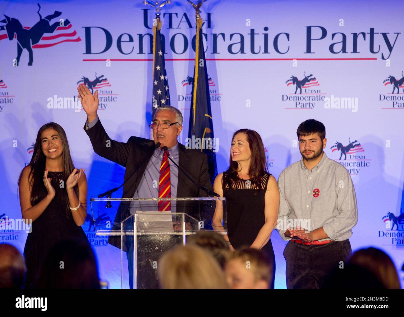 Salt Lake County District Attorney Sim Gill, second from left, gives a