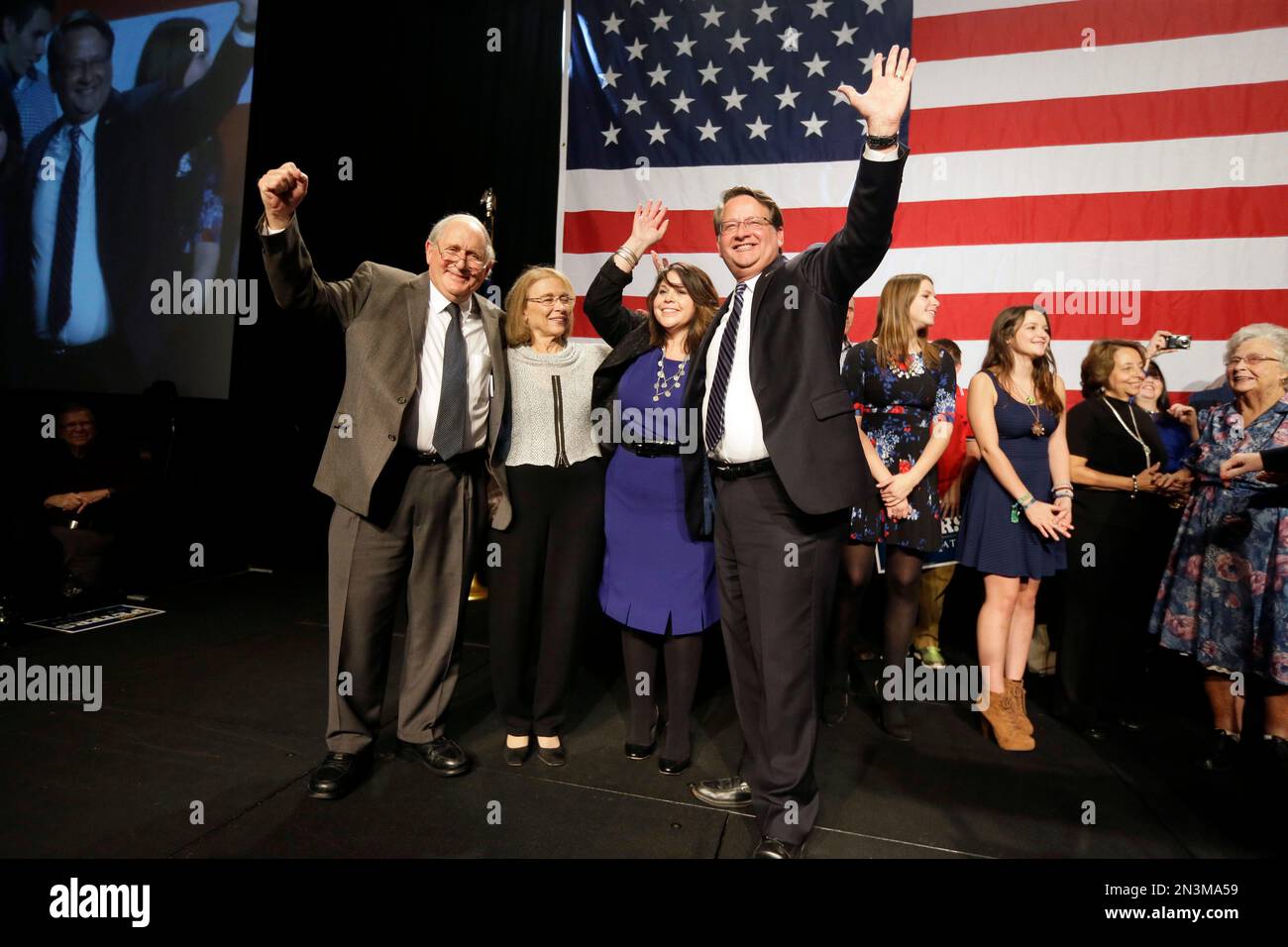 U.S. Senate elect Gary Peters stands with his wife Colleen, center, with  retiring Sen. Carl Levin, Levin's wife Barbara Halpern-Levin, and Sen.  Debbie Stabenow, right, after Gary Peters addressed supporters in Detroit,, image size:1300x956