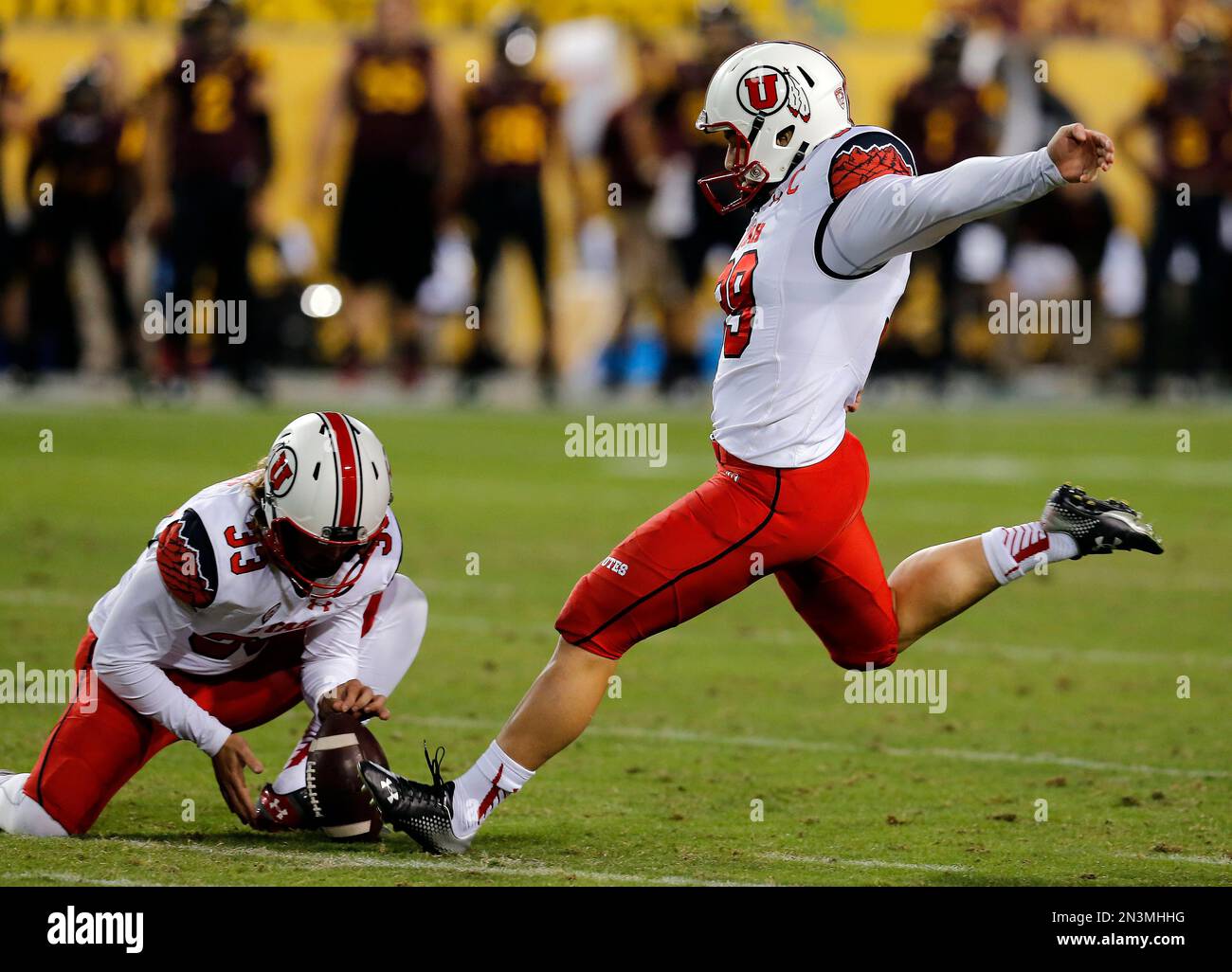 Utah place kicker Andy Phillips (39) in the first half during an NCAA