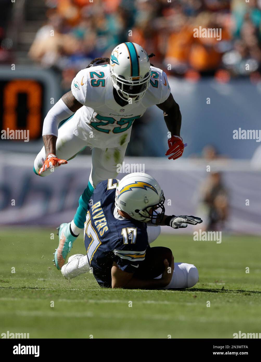 Miami Dolphins Free Safety Louis Delmas (25) Jumps Over San Diego ...