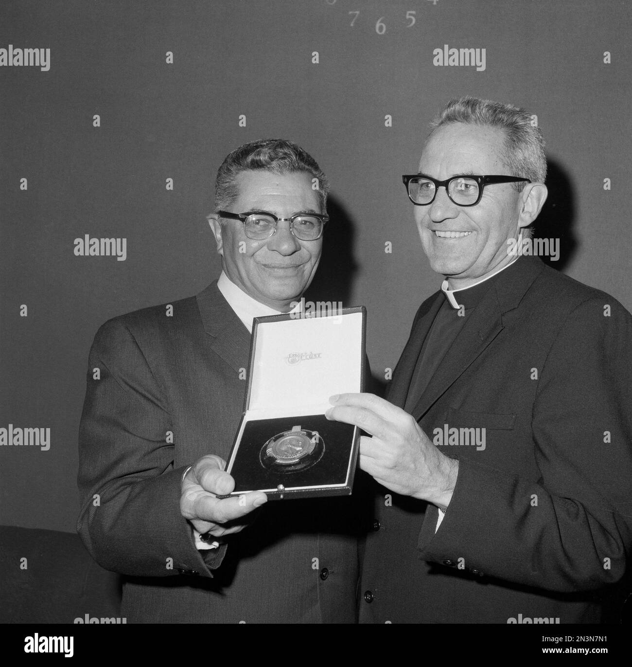 Green Bay Packers coach Vince Lombardi, left, is awarded the Insignis