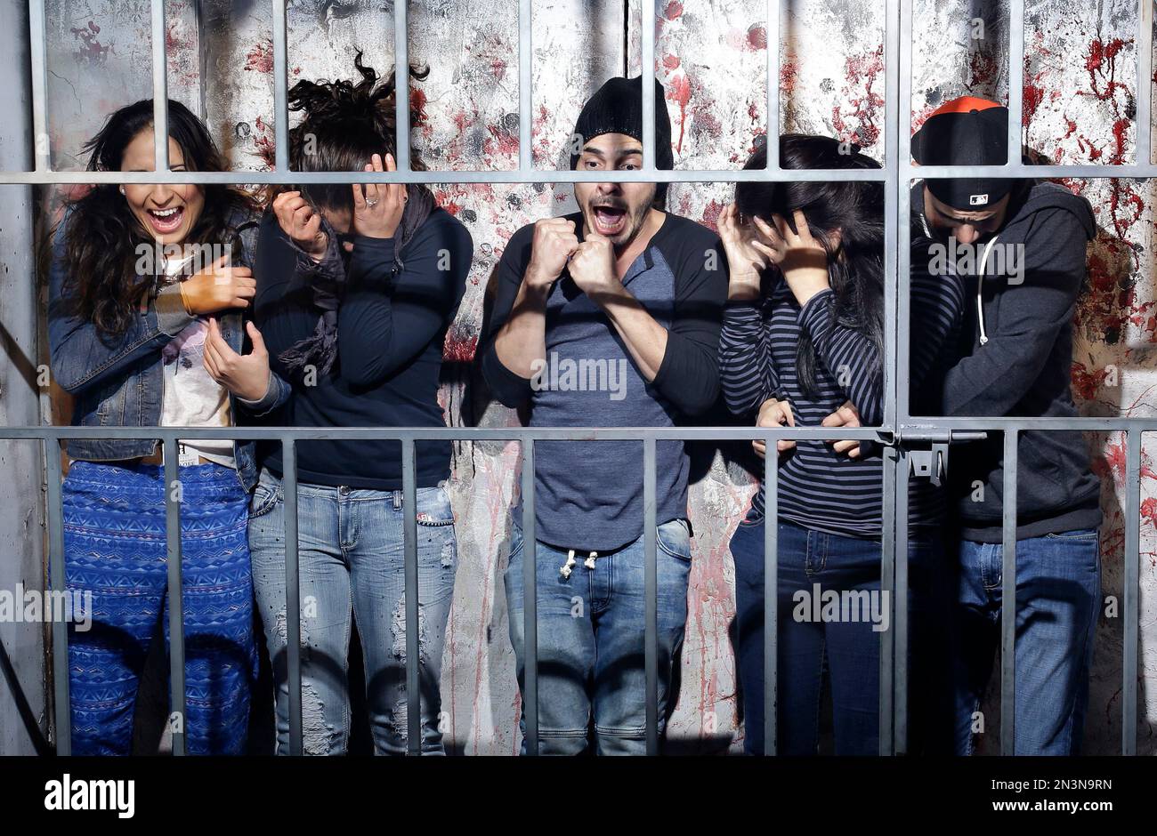 In this Oct. 27, 2014, photo, people react to a mock execution in the Gates of Hell haunted