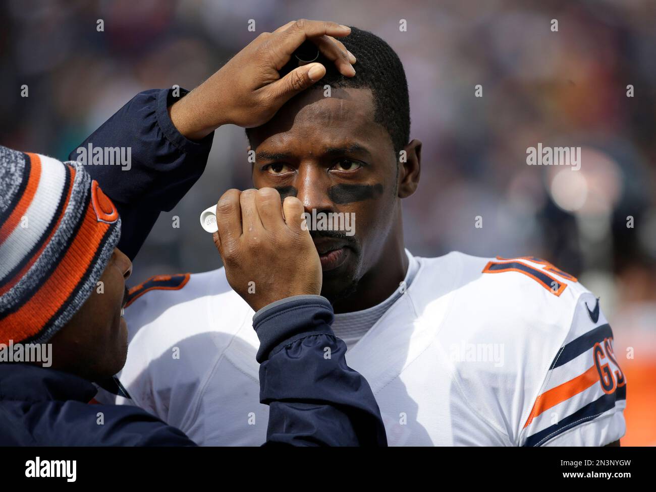 Chicago Bears wide receiver Josh Morgan (19) has eye black applied to his  eyes before an NFL football game against the New England Patriots on  Sunday, Oct. 26, 2014, in Foxborough, Mass. (